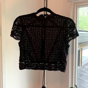 Adorable crochet crop top with high collar and back buttons.